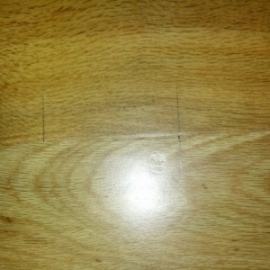 check mark moved the distance of the straight edge away from second side to cut...