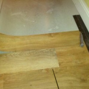 cutting the second side using the straight edge as the scribe...