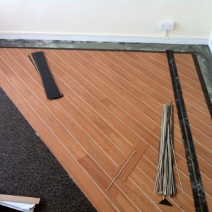 marly strip wood on 45 with lacings and 2 1/2 border over acoustic cork underlay
