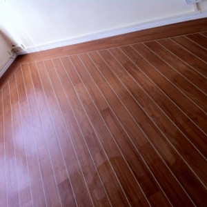 marly strip wood on 45 with lacings and 2 1/2 border over acoustic cork underlay