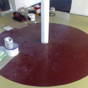 mono pave studded rubber with red circle set out and cut in using same size tiles