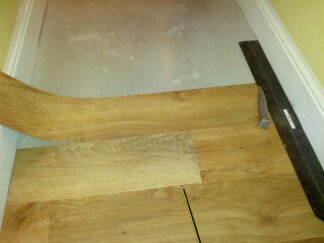cutting the second side using the straight edge as the scribe...