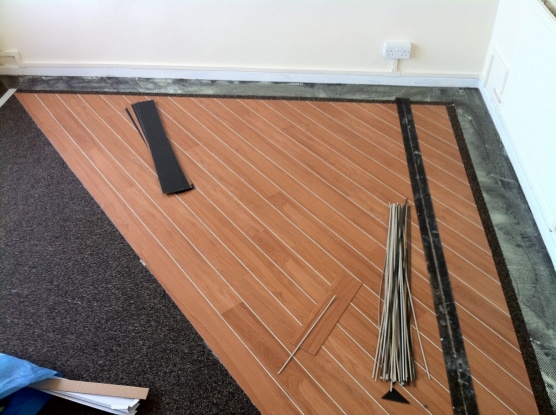 marly strip wood on 45 with lacings and 2 1/2 border over acoustic cork underlay
