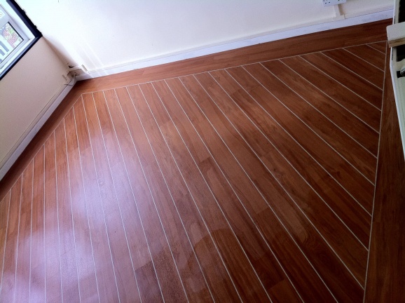 marly strip wood on 45 with lacings and 2 1/2 border over acoustic cork underlay