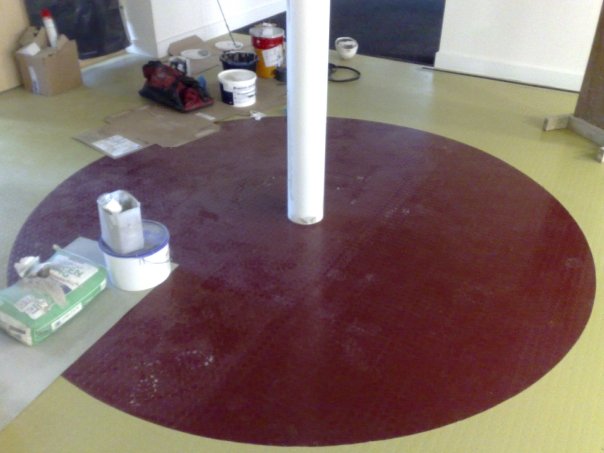 mono pave studded rubber with red circle set out and cut in using same size tiles